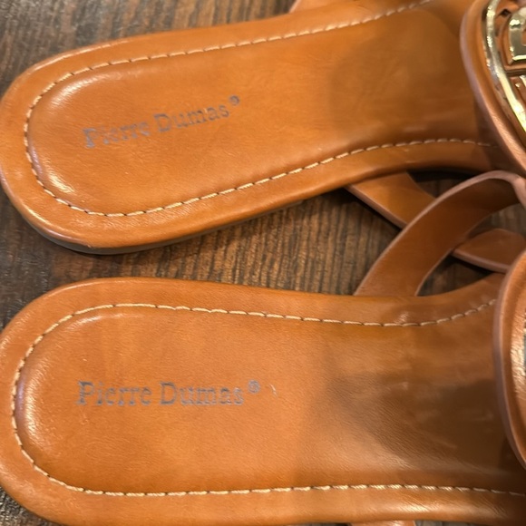Tan Pierre Dumas limit style slip on sandal with gold emblem detail. - Picture 2 of 4